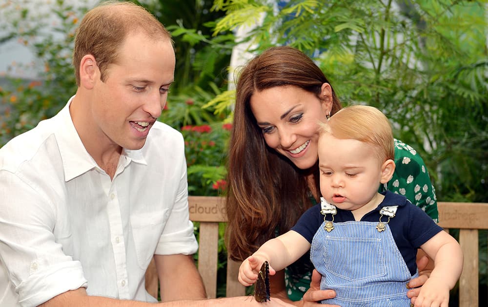 File Photo- Britain`s Prince William, Kate Duchess of Cambridge and Prince George. Today happens to be baby Prince George`s first birthday.