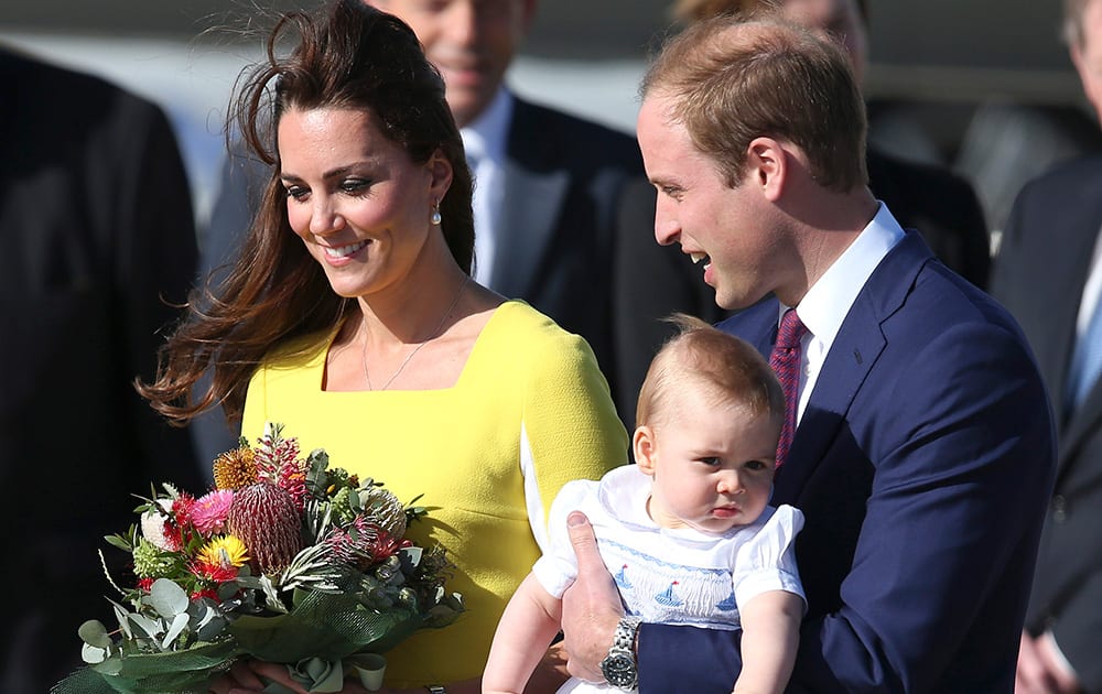 File Photo- Britain`s Prince William, Kate Duchess of Cambridge and Prince George. Today happens to be baby Prince George`s first birthday.