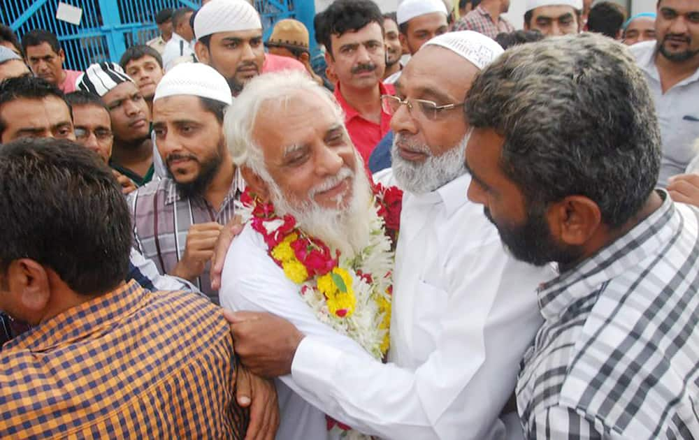 Relatives and family members greet an accused of the 1993 Surat bomb blasts case, after he was released from the jail in Surat.