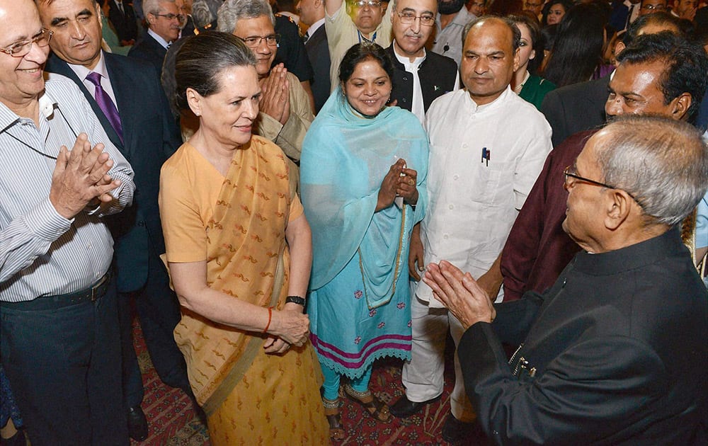 President Pranab Mukherjee with UPA chairperson Sonia Gandhi and others during an Iftar party at Rashtrapati Bhawan in New Delhi.