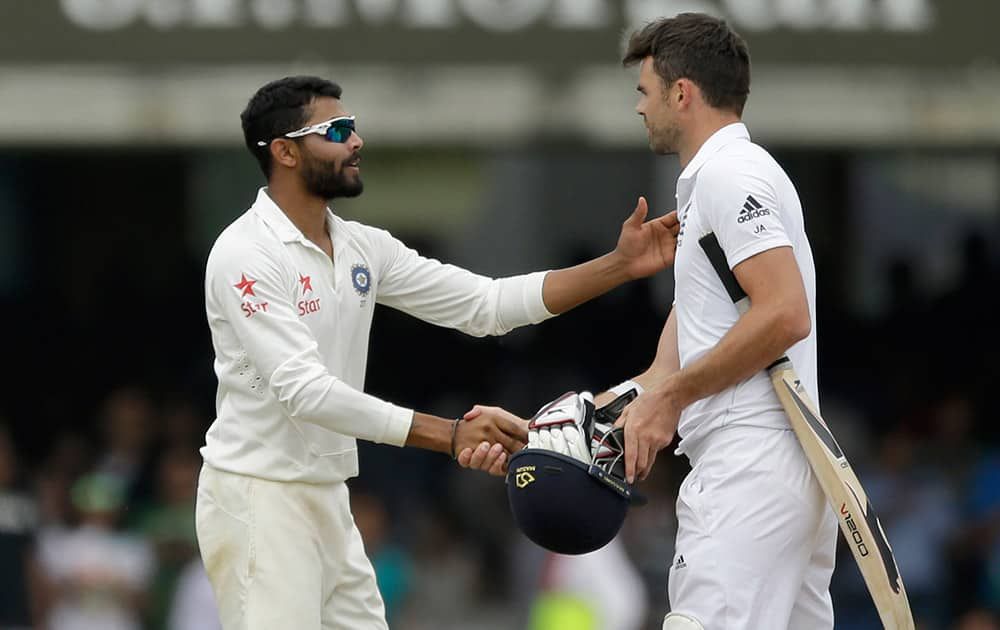 India`s Ravindra Jadeja, left, shakes hands with England`s James Anderson after running him out to win the test match on the fifth day of the second cricket test match between England and India at Lord`s cricket ground in London.