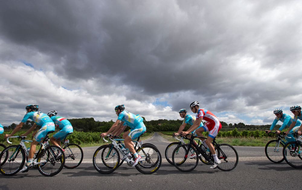 Team Astana with overall leader Italy`s Vincenzo Nibali, second left with the Italian flag on his jersey, trains on the second rest day of the Tour de France cycling race in Lignan-sur-Orb, southern France.