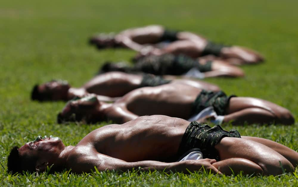 Taiwan Marine Corps `Frog Men` display stretching routines during a tour at the naval base in Zuoying, southern Taiwan.