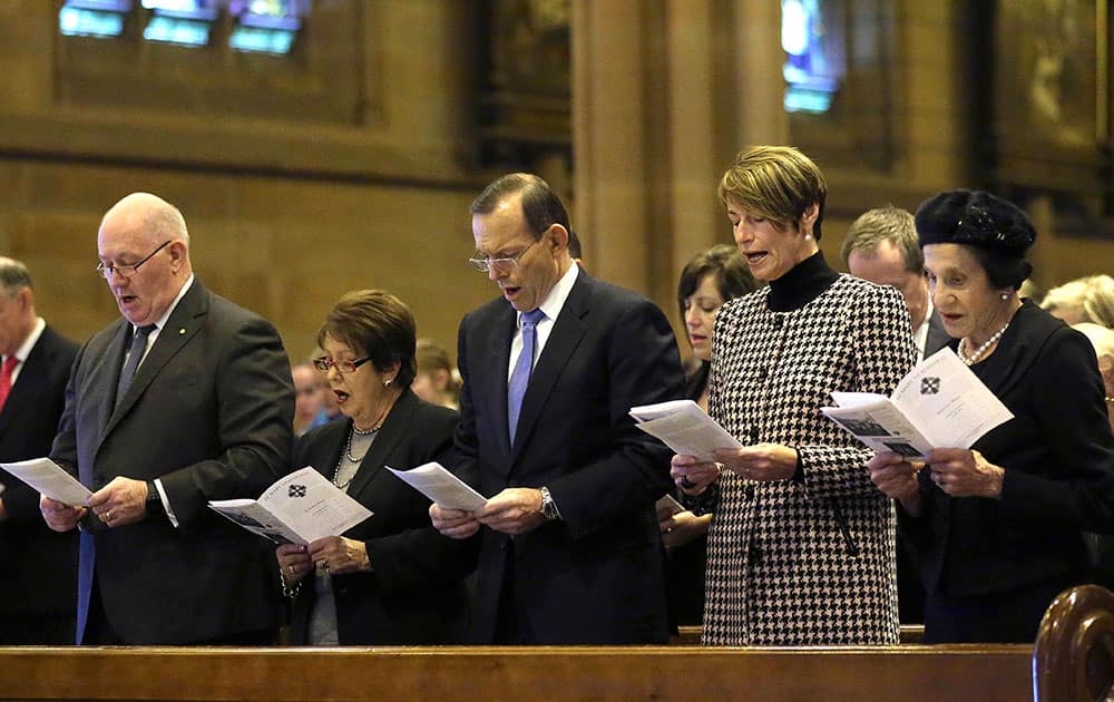 From right: New South Wales Governor Marie Bashir, Margie Abbott, Australia`s Prime Minister Tony Abbott, Lady Lynne Cosgrove and Governor General Sir Peter Cosgrove sing a hymn during a Mass at St. Mary`s Cathedral commemorating victims of Malaysia Airlines Flight 17, in Sydney.