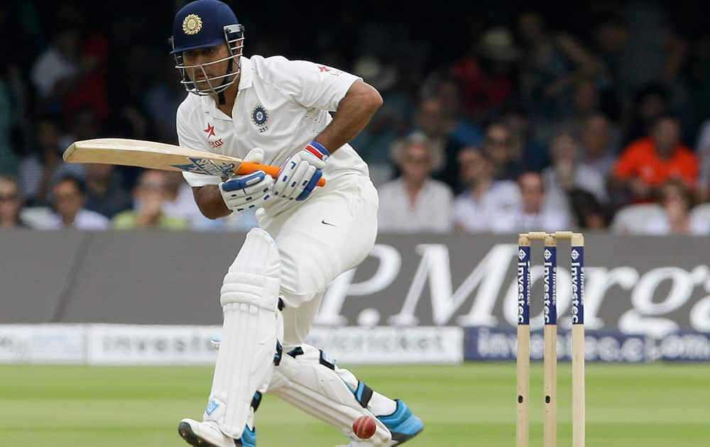 India`s MS Dhoni plays a shot off the bowling of England`s James Anderson during the fourth day of the second test match between England and India at Lord`s cricket ground in London.