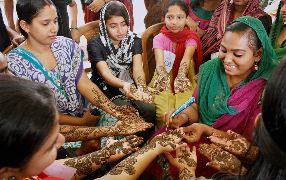 Women participate in a Mehendi competition ahead of Ramadan month in Kozhikode.