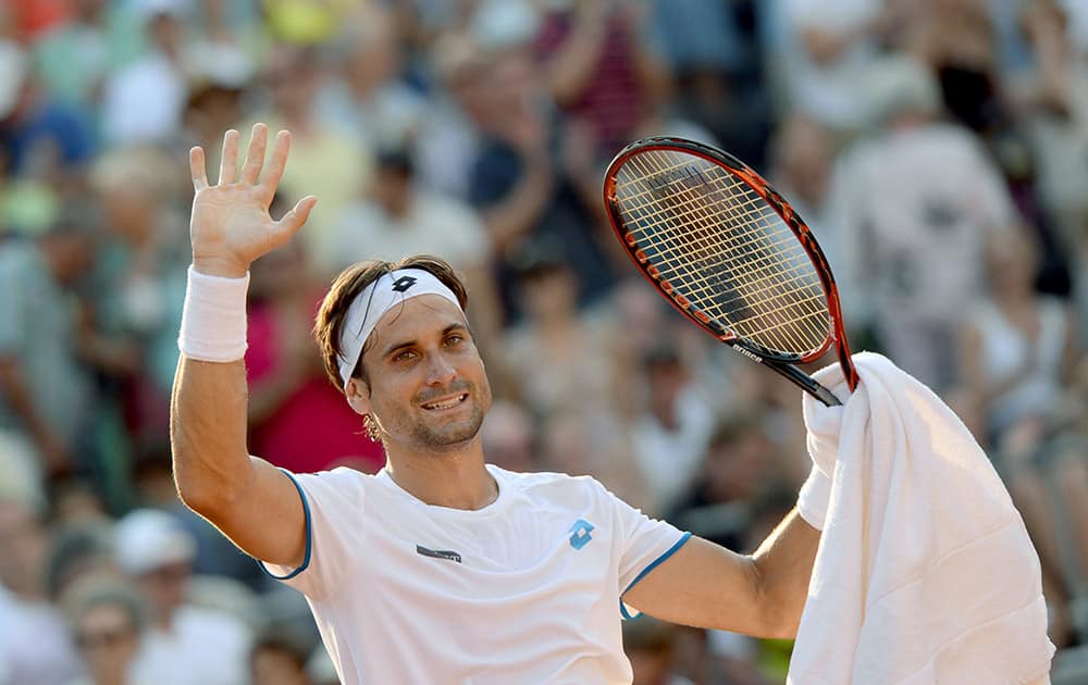 Spanish tennis player David Ferrer cheers after winning the semifinal against Alexander Zverev of Germany during the ATP tournament in Hamburg, Germany.