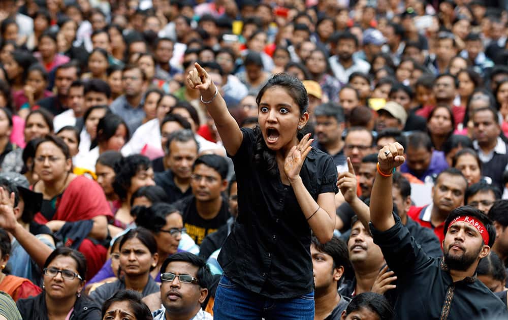 An angry protester points her finger towards the Bangalore police chief during a protest against alleged police inaction after a six-year-old was raped at a school, in Bangalore.