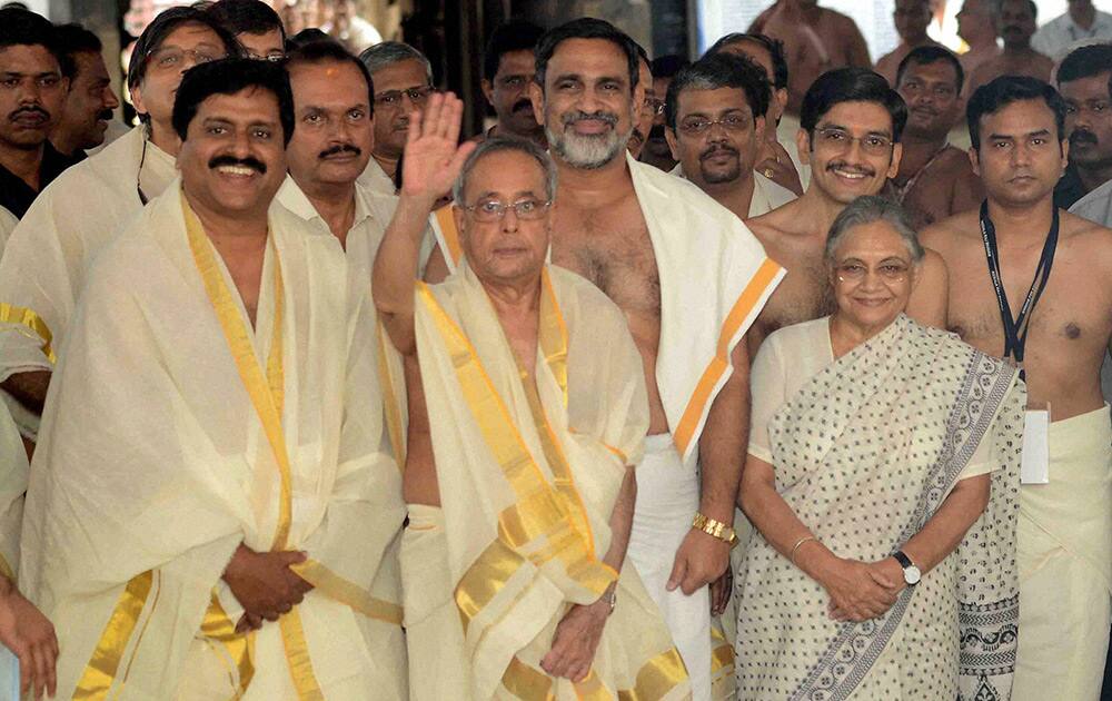 President Pranab Mukherjee with Kerala Governor Sheila Dikshit and other during a visit to Sree Padmanabahaswamy temple in Thiruvananthapuram.