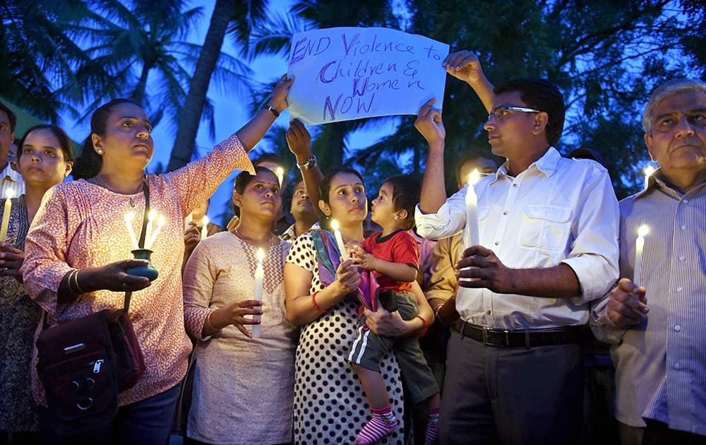 Parents of Vibgyor School kids hold a candle march at a school where a 6-year-girl was raped last week, in Bengaluru.