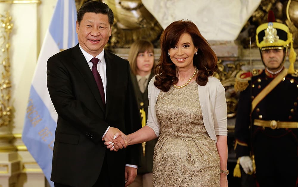 China`s President Xi Jinping and Argentina`s President Cristina Fernandez pose for a photo, shaking hands at Casa Rosada presidential palace in Buenos Aires, Argentina.