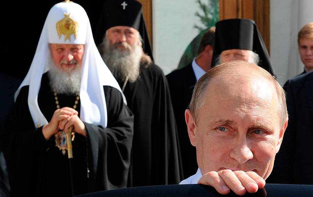 Russian President Vladimir Putin leaves after his meeting with Russian Orthodox Patriarch Kirill as he attends celebrations marking the 700th anniversary of St. Sergius of Radonezh in the Trinity St. Sergius monastery in Sergiyev Posad, northeast of Moscow.