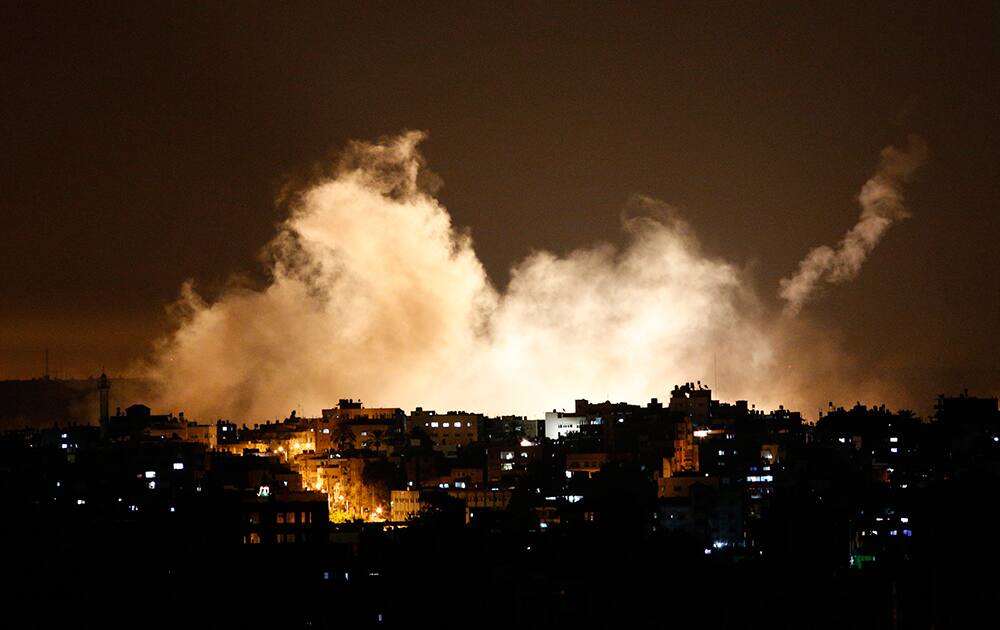 Smoke from flares rises in the sky in Gaza City. Israel launched a large-scale ground offensive in the Gaza Strip Thursday, escalating a 10-day military operation to try to destroy Hamas` weapons arsenal, rocket firing abilities and tunnels under the Palestinian territory`s border with Israel. It was the first major Israeli ground offensive in Gaza in just over five years.