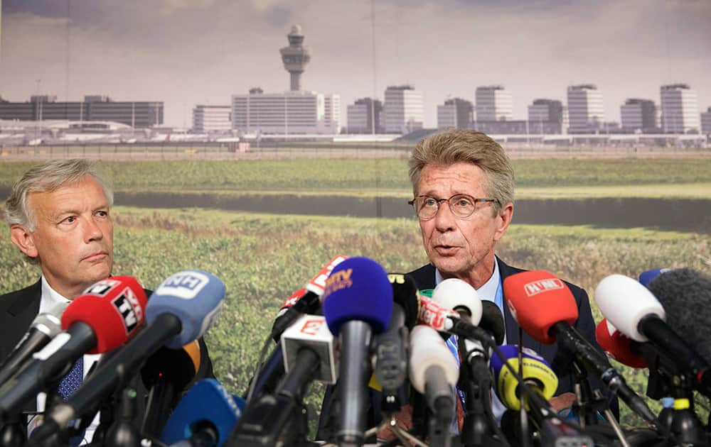 Huib Gorter, senior vice-president of Malaysia Airlines, right, speaks at a press conference as Jos Nijhuis, president and CEO of Schiphol, left, listens, at Schiphol airport in Amsterdam.