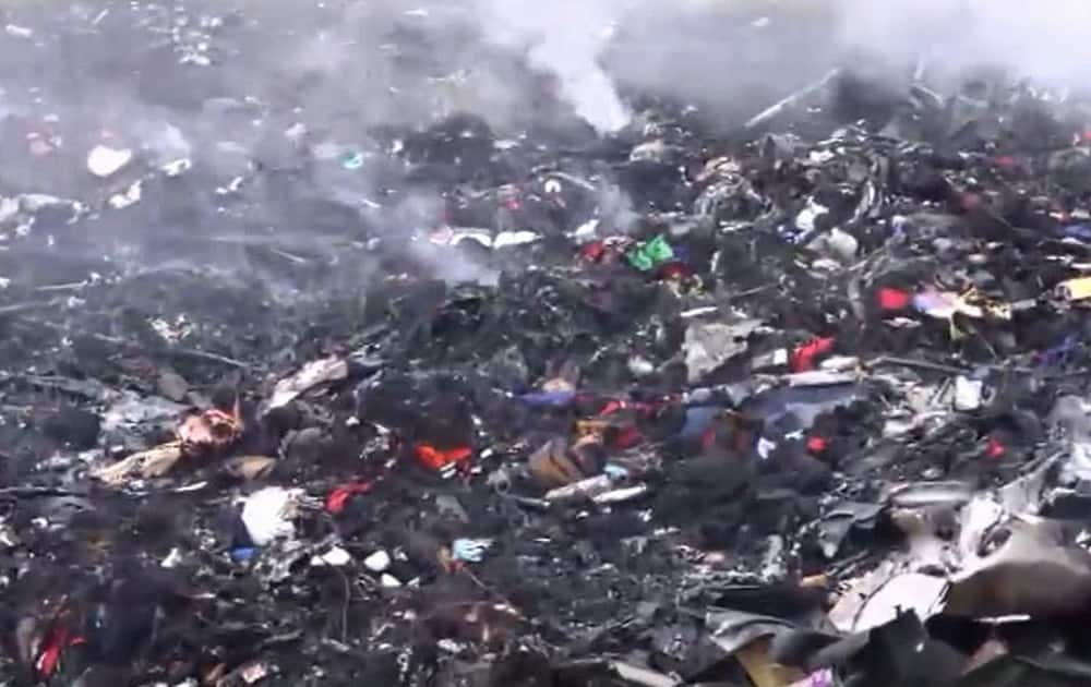 This image taken from video, showing debris at the crash site after a passenger plane carrying 295 people was shot down Thursday as it flew over Ukraine, near the village of Hrabove, in eastern Ukraine.