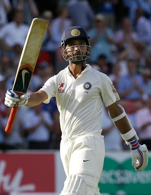 India`s Ajinkya Rahane takes applause for scoring a century as he leaves the field after being caught and bowled by England`s James Anderson, during the first day of the second test match between England and India at Lord`s cricket ground in London.