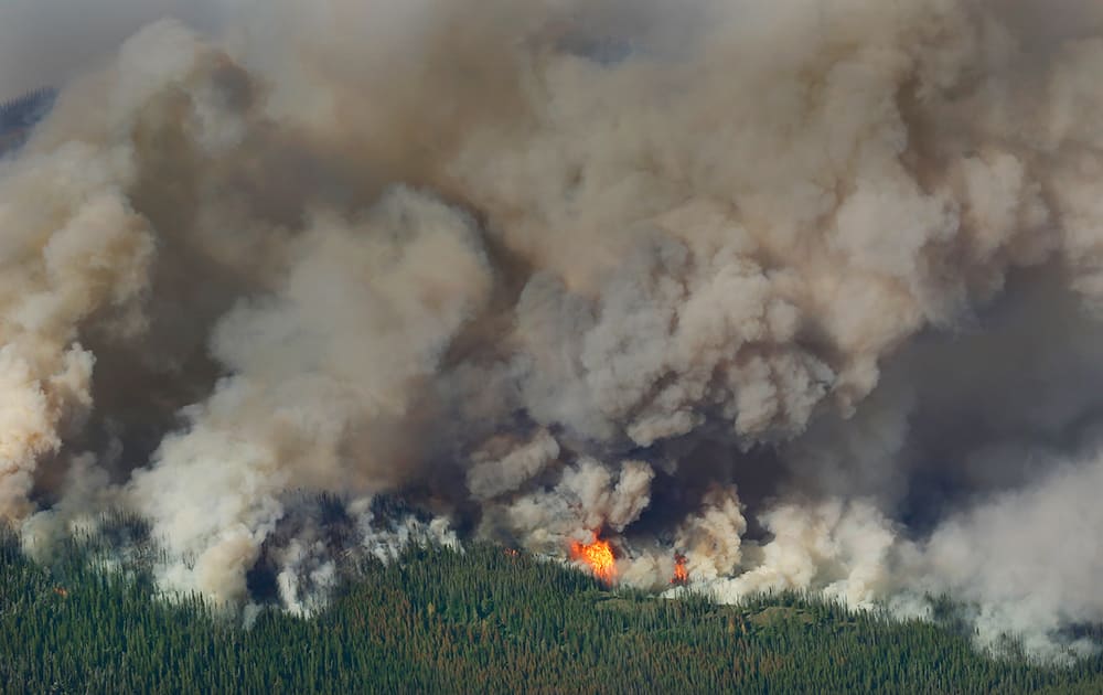 Smoke and flames rise from the Chiwaukum Creek Fire near Leavenworth, Wash.