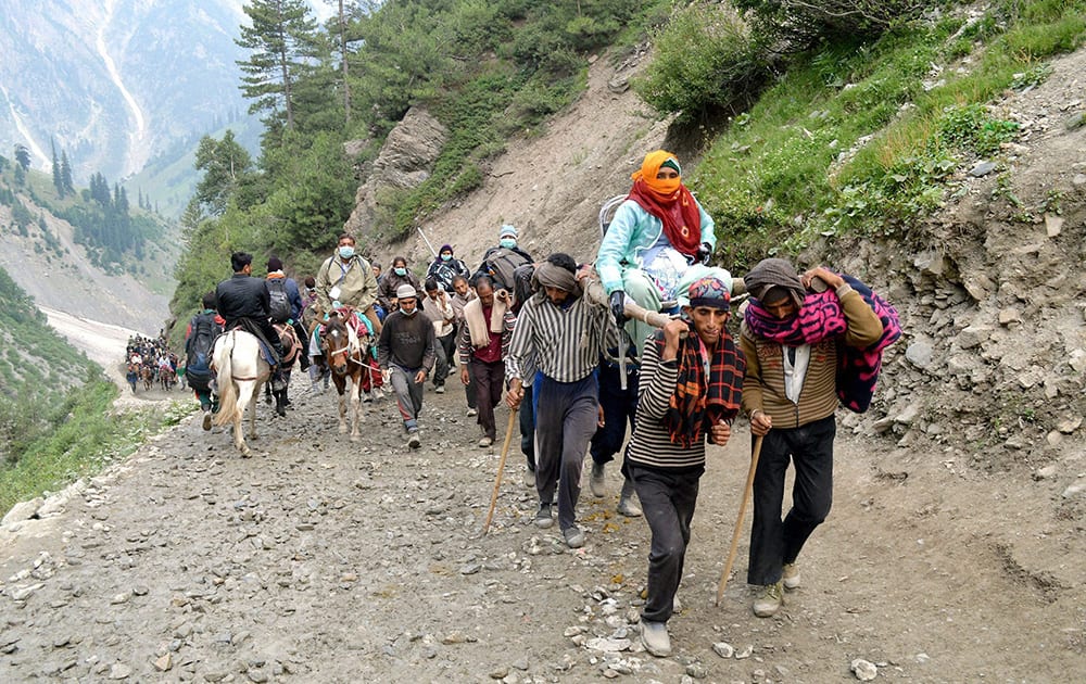 Pilgrims proceed towards the Holy Amarnath Cave Shrine at Chandanwari in Jammu & Kashmir.