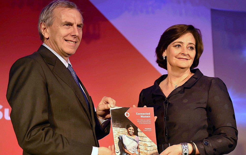 Vodafone CEO and Managing Director, Marten Pieters (L) and founder of the Cherie Blair Foundation for Women, Cherie Blair launch the Vodafaone Connected Women Report 2014 in New Delhi.