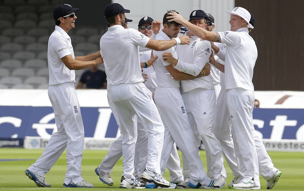 England`s James Anderson celebrates the wicket of India`s Shikhar Dhawan during the first day of the second test match between England and India at Lord`s cricket ground in London.