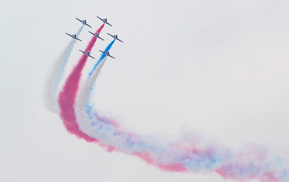 Taiwan`s AT-3 jet trainers fly in close formation over Taichung Air Force base during an air show rehearsal in Taichung, central Taiwan.