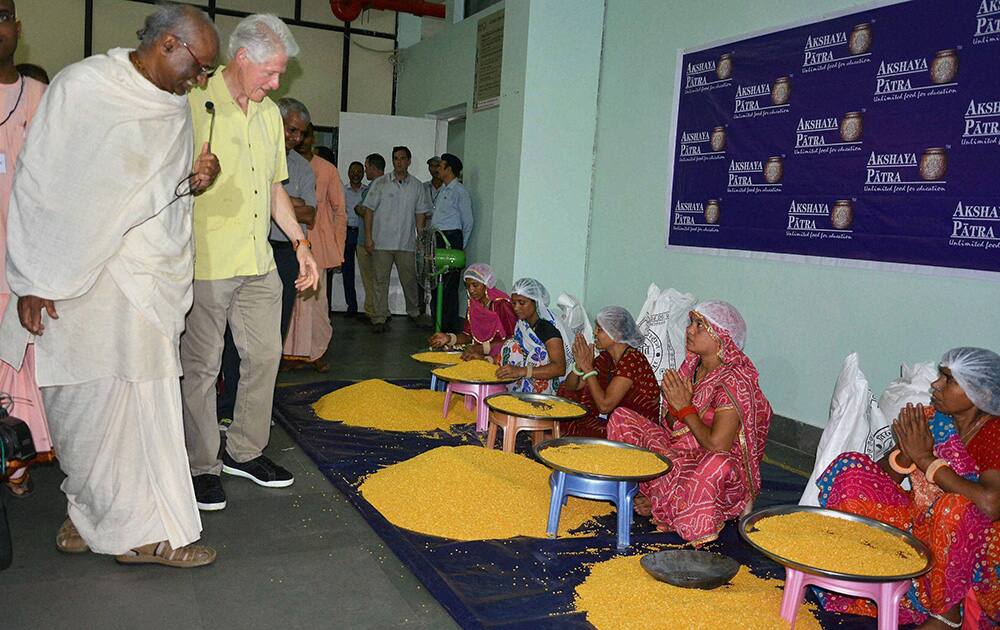 Former US President Bill Clinton during a visit to `Akshaya Patra` kitchen in Jaipur.