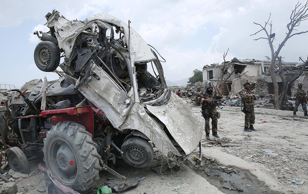 Afghanistan`s security forces patrol the site of a suicide attack in the Urgun town of Paktika province, Afghanistan.