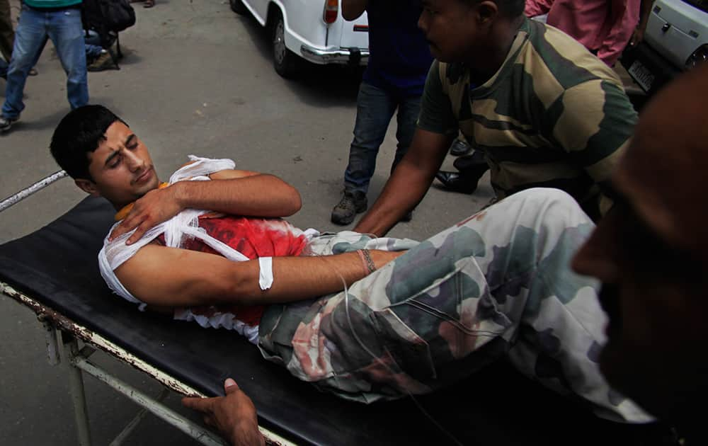 A Border security force (BSF) soldier, injured in reported firing from the Pakistani side of the border, is carried on a stretcher for treatment to the Government Medical College hospital in Jammu.