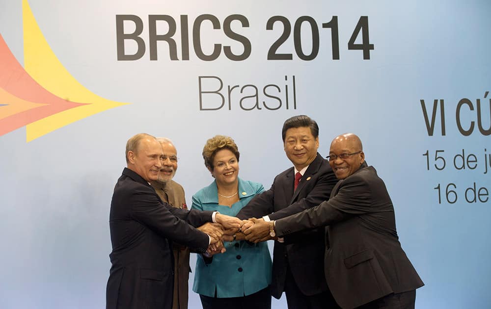 LEADERS OF THE BRICS NATIONS, FROM LEFT, RUSSIA`S PRESIDENT VLADIMIR PUTIN, INDIA`S PRIME MINISTER NARENDRA MODI, BRAZIL`S PRESIDENT DILMA ROUSSEFF, CHINA`S PRESIDENT XI JINPING AND SOUTH AFRICA`S PRESIDENT JACOB ZUMA, POSE FOR A GROUP PHOTO DURING THE BRICS SUMMIT IN FORTALEZA, BRAZIL.