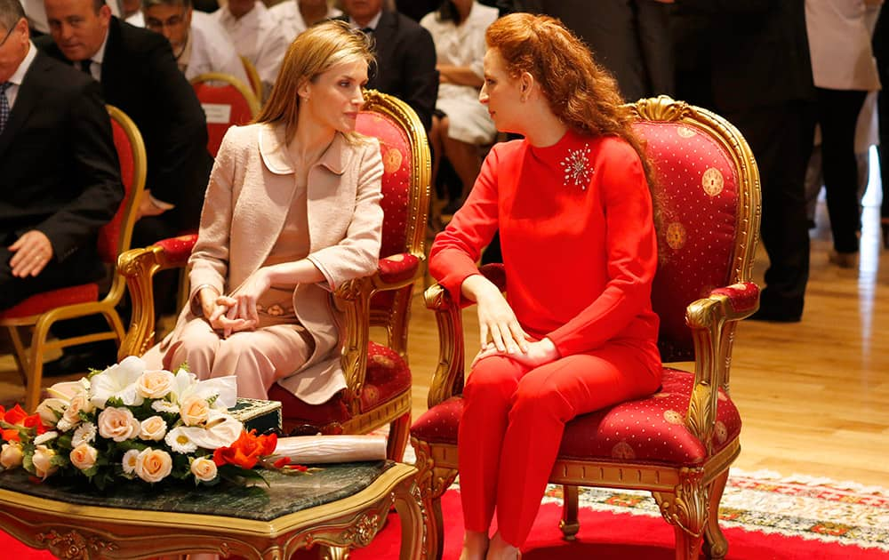 Queen Letizia of Spain, left, and Morocco`s Princess Lalla Salma, wife of King Mohammed VI and chairwoman of the Lalla Salma Foundation for Cancer Prevention and Treatment share the light moment during their visit at the Sheikha Fatma Centre for Gynaecological-Mammary Oncology, at the National Oncology Institute affiliated to the Ibn Sina University Hospital in Rabat.