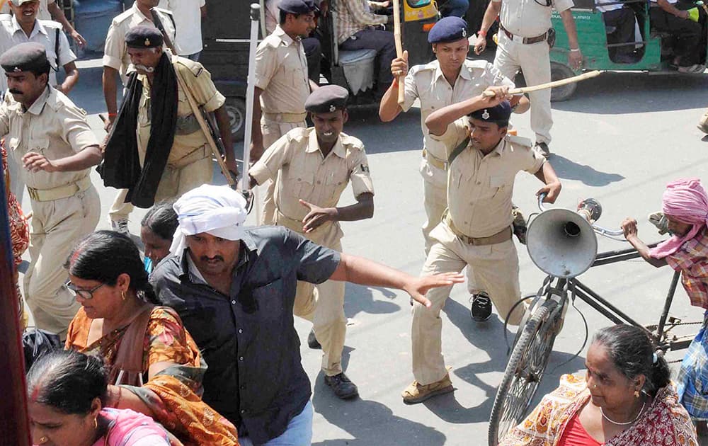 Police lathi charge teachers of Bihar Rajya Niyojit Shikshak Sangharsh Morcha during a protest for the release of their pending salaries in Patna.