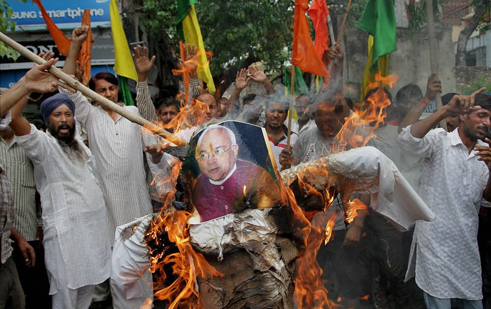 Activists of Shiv Sena and Dogra front burn an effigy of Ved Partap Vaidik during a protest in Jammu.