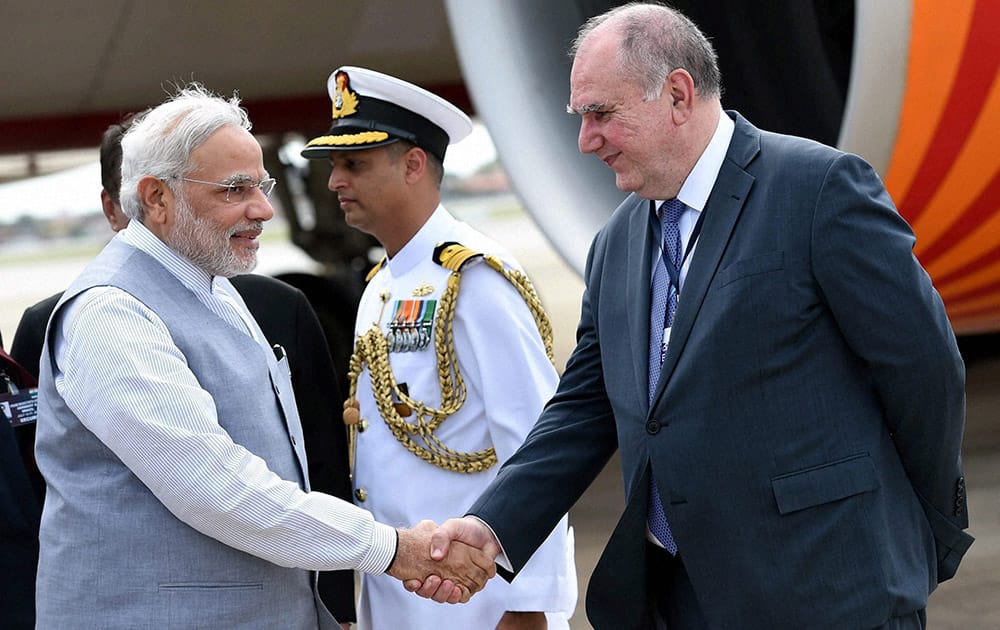 PRIME MINISTER NARENDRA MODI BEING WELCOMED AT THE AIRPORT BY CHIEF COORDINATOR OF BRICS AND THE BRAZILIAN FOREIGN MINISTRY LOUISE LOPES AT FORTALEZA IN BRAZIL.