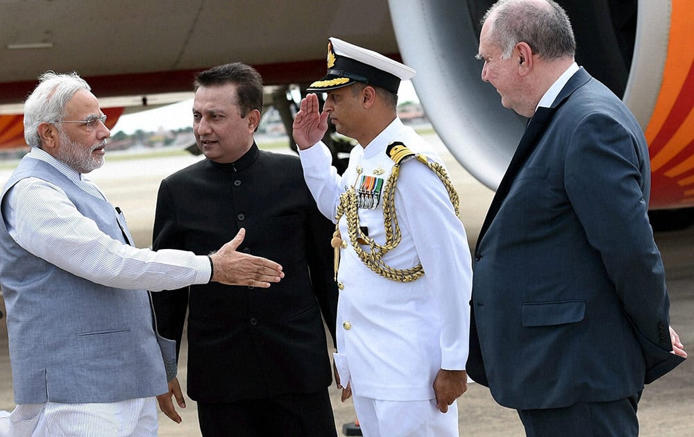 Prime Minister Narendra Modi being received by Indian ambassador to Brazil, Ashok Tomar and chief coordinator of BRICS and the Brazilian Foreign Ministry Louise Lopes at the airport at Fortaleza in Brazil.