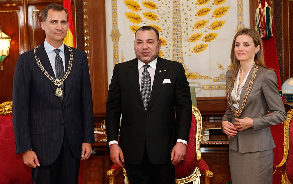 King Mohammed VI of Morocco, center, poses for photographers with Spain`s King Felipe VI, left, and his wife, Spain`s Queen Letizia, prior to their meeting at the royal palace in Rabat, Morocco.