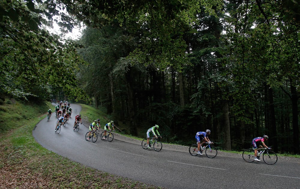 The pack rides downhill during the tenth stage of the Tour de France cycling race over 161.5 kilometers (100.4 miles) with start in Mulhouse and finish in La Planche des Belles Filles, France.