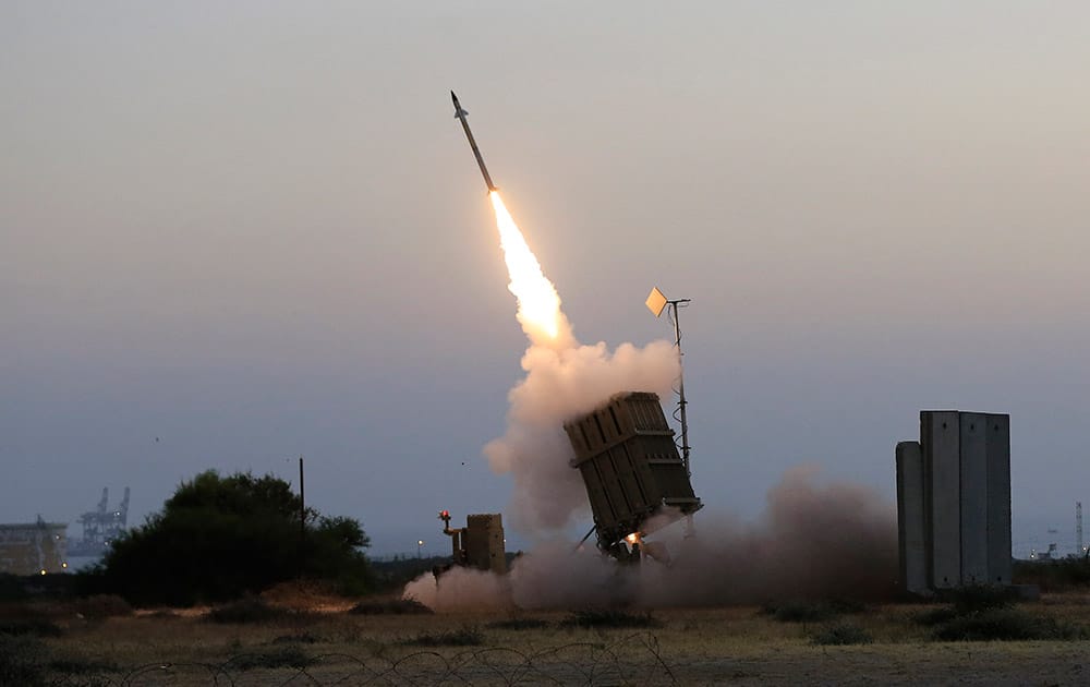 An Iron Dome air defense system fires to intercept a rocket from Gaza Strip in the costal city of Ashkelon, Israel. Israel says its punishing air assault on Hamas militants, their property and their weaponry has delivered a devastating blow to the Islamic militant group. 