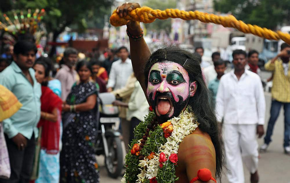 Pothuraju, a devotee of Hindu goddess Kali performs a ritual at the Bonalu festival procession at Secunderabad Ujjaini Mahakali temple in Hyderabad.