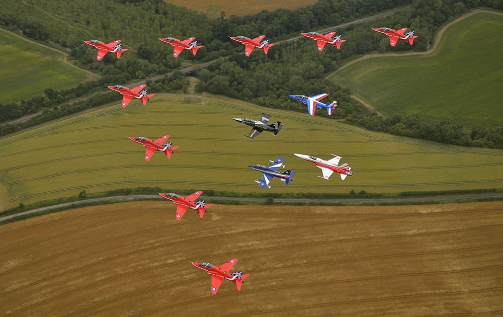 To celebrate the RAF’s Red Arrows 50th display season, they were joined in a large arrow formation flypast with Breitling Jet Team number one pilot, Jacques Bothelin leading the inner formation of other renowned European jet display teams from France, Switzerland and Italy at the Royal International Air Tattoo at RAF Fairford in Gloucester, UK.