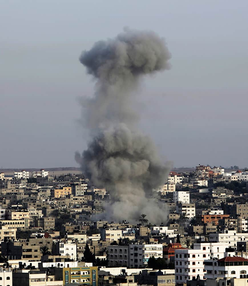 Smoke rises following an Israeli strike on Gaza Strip.