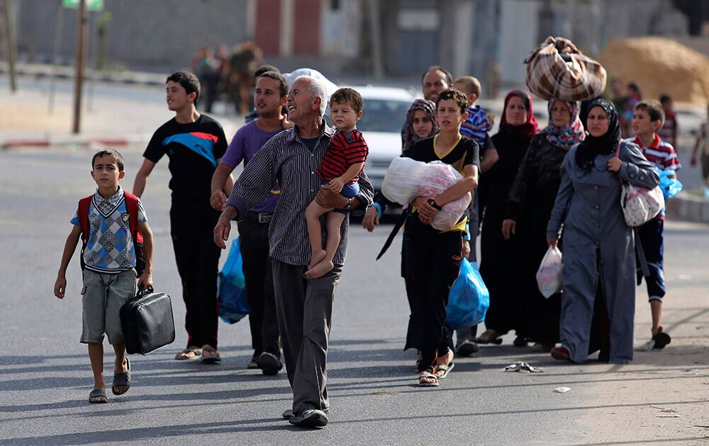 Palestinians flee their homes to take shelter at the United Nations school in Gaza City.