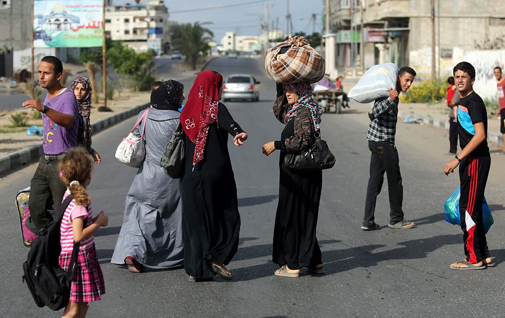 Palestinians flee their homes to take shelter at the United Nations school in Gaza City.