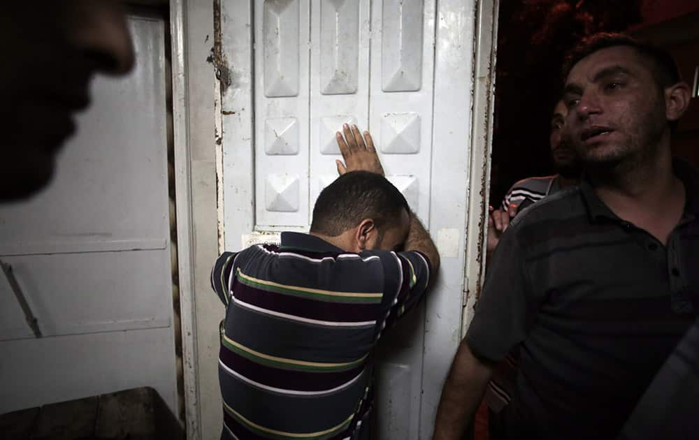 Palestinians mourn their relatives in the morgue of the Shifa hospital in Gaza City.