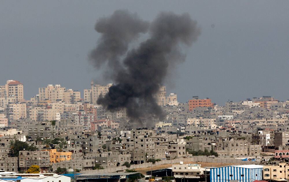 Smoke rises following an Israeli strike on Gaza, seen from the Israel-Gaza border