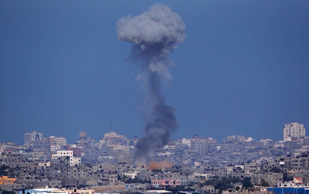 Smoke rises following an Israeli strike on Gaza, seen from the Israel-Gaza Border. Rocket fire by Palestinian militants continued in earnest from Gaza toward various locations in southern Israel.