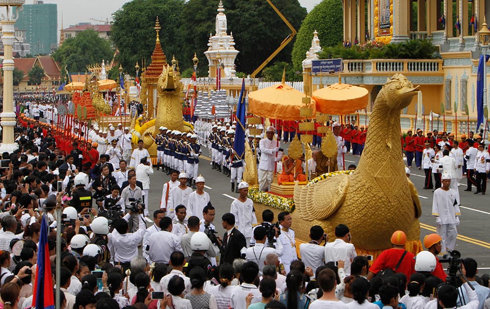 A Cinerary urn contains the ashes of late former Cambodian King Norodom Sihanouk is guarded in a procession to a stupa at Royal Palace during a three-day Buddhist ceremony, in Phnom Penh, Cambodia.