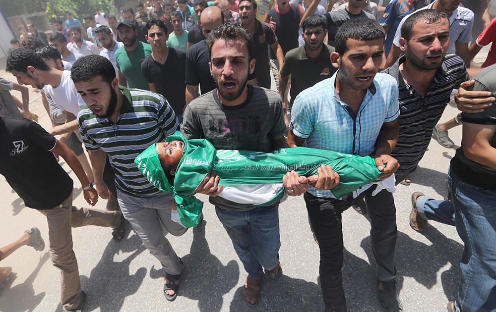 Palestinians carry the body of 3-year-old Mohammed Mnassrah during his funeral in the Maghazi refugee camp, central Gaza Strip.