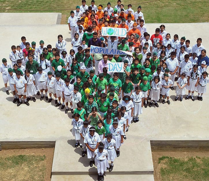 School students make a human Indian map during an awarness drive on the eve of Wolrd Population Day in Patiala.