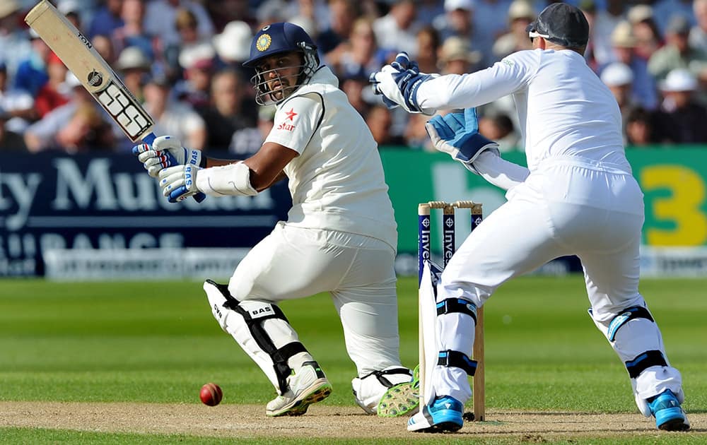 India`s Murali Vijay plays a shot past England wicket keeper Matt Prior, right, during day one of the first Test between England and India at Trent Bridge cricket ground, Nottingham, England.