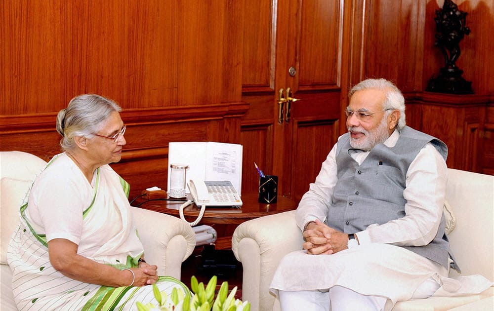 Prime Minister Narendra Modi and Governor of Kerala, Sheila Dikshit at a meeting in New Delhi.